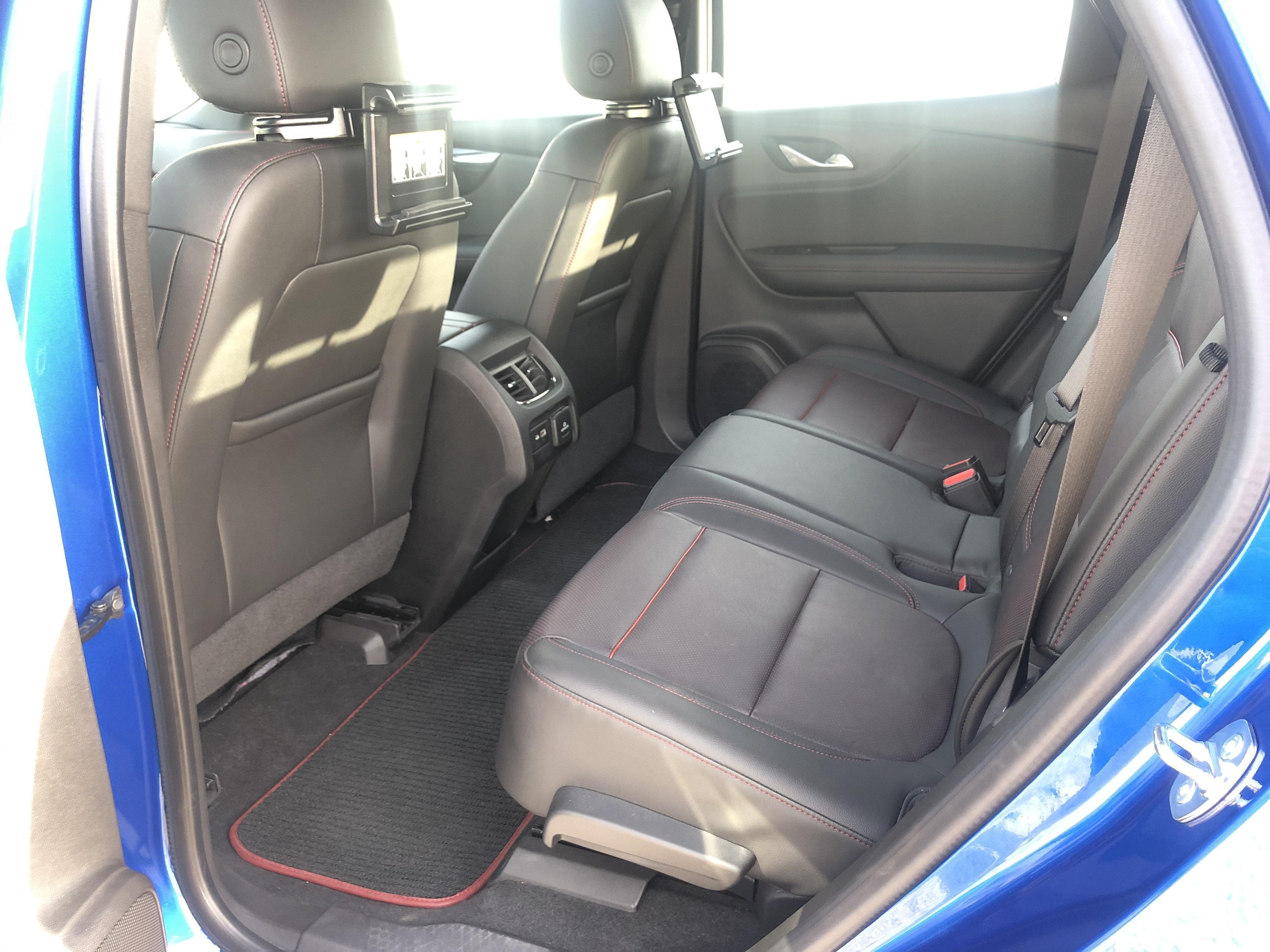 There is plenty of space for five full-size adults passengers, and the seats are comfortable. They are perforated black leather with red accents in the perforations, piping, and stitching. 