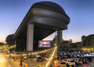VOX cinema holds a drive-in experience on the roof of Mall of Emirates for all the movie-lovers projecting the video on a large screen with snacks included